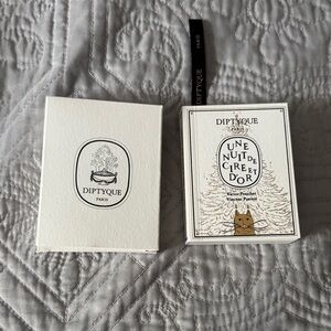 Diptyque Paris Cream and Black Candle Packaging